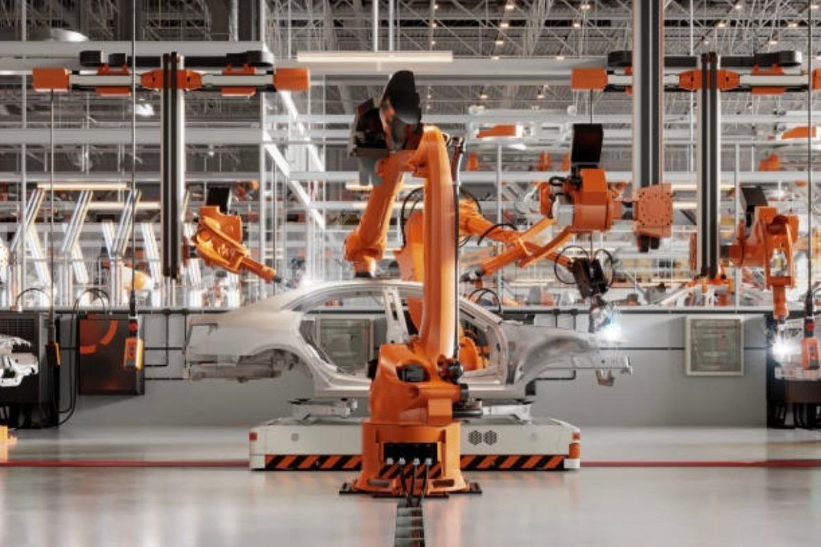 Robotic arms assembling a car body on an automated production line